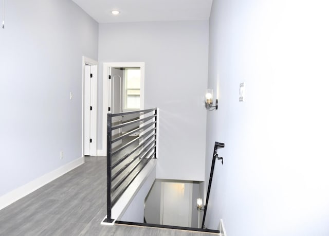 stairway featuring hardwood / wood-style floors