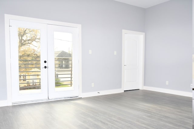 unfurnished room featuring dark wood-type flooring