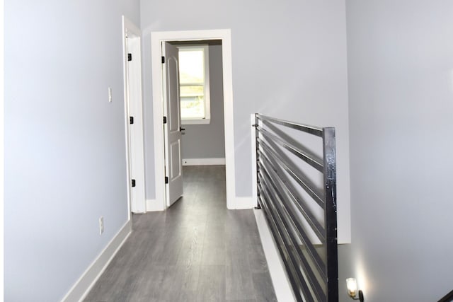 hallway with dark hardwood / wood-style floors