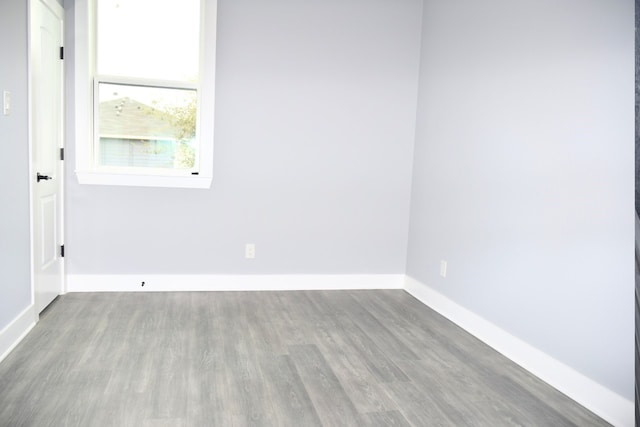 unfurnished room with light hardwood / wood-style floors