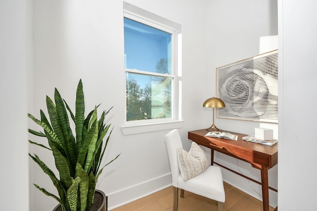 office with light hardwood / wood-style flooring