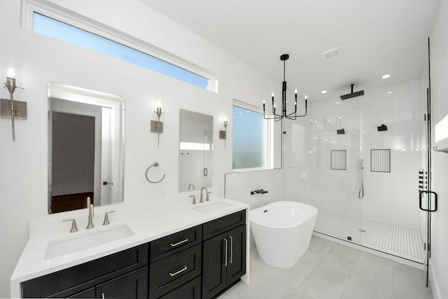 bathroom with vanity, independent shower and bath, tile patterned flooring, and a notable chandelier