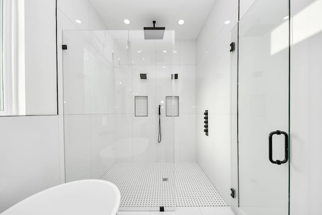 bathroom with shower with separate bathtub