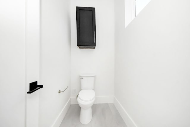 bathroom featuring tile patterned floors and toilet