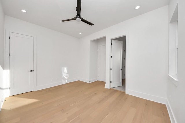 unfurnished bedroom with ceiling fan and light hardwood / wood-style floors