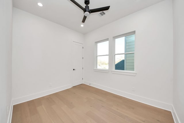 unfurnished room with light hardwood / wood-style flooring and ceiling fan