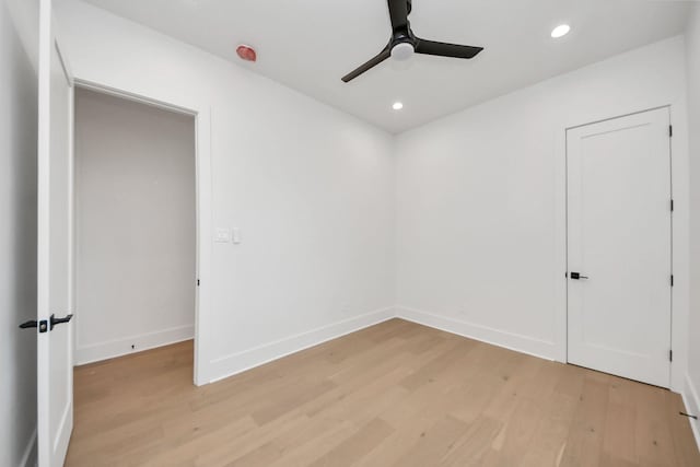 empty room featuring ceiling fan and light wood-type flooring