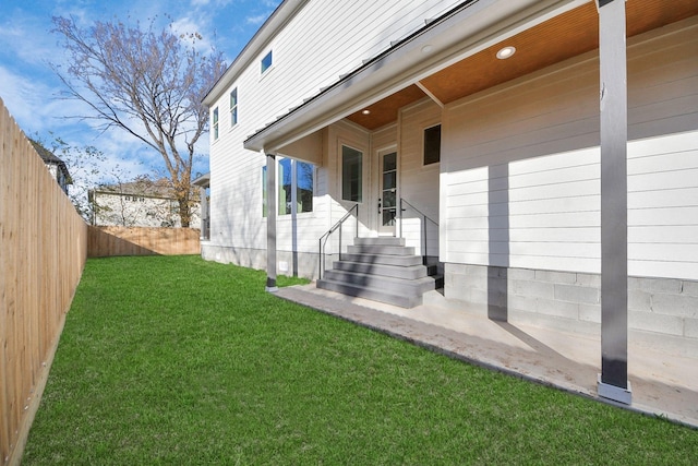 property entrance featuring a yard