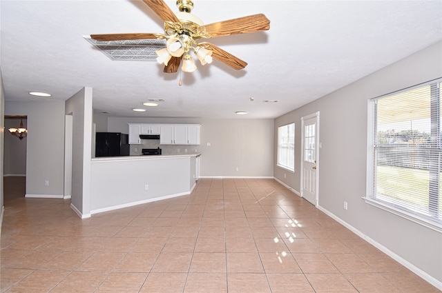 unfurnished living room with light tile patterned floors and ceiling fan