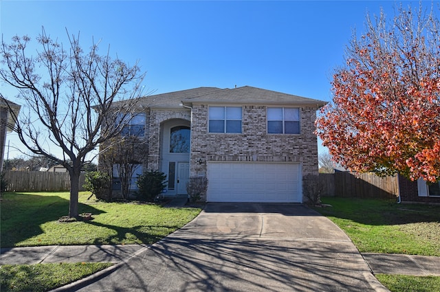 view of front of property featuring a garage and a front yard