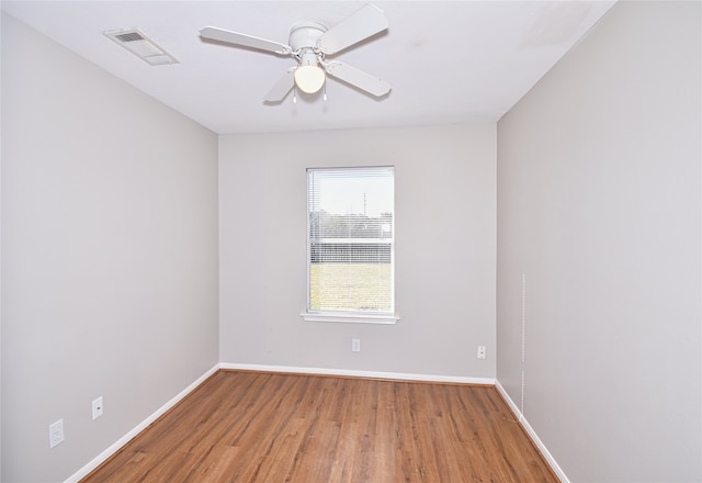 unfurnished room with hardwood / wood-style floors and ceiling fan