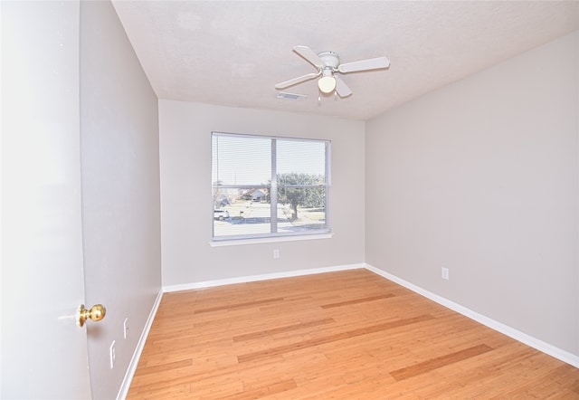 unfurnished room featuring hardwood / wood-style floors and ceiling fan