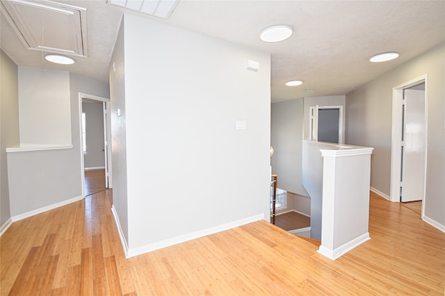 hallway with light wood-type flooring