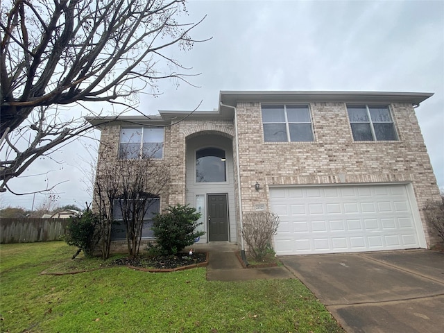 view of front of home featuring a garage and a front yard