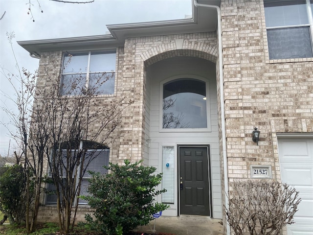 property entrance with a garage