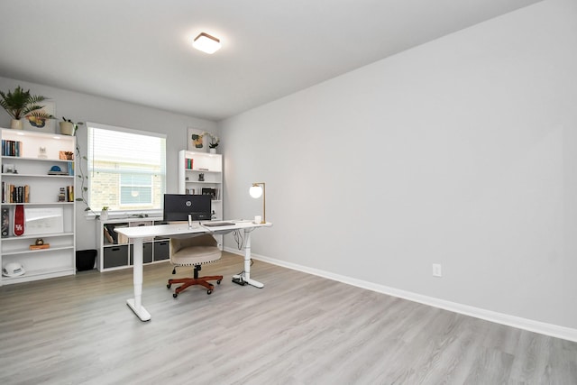 office space with light wood-type flooring