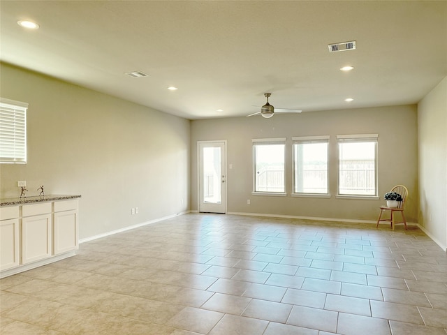 spare room with ceiling fan