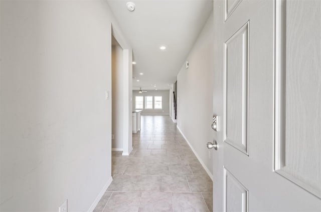 hallway featuring light tile patterned flooring