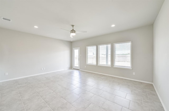 unfurnished room featuring ceiling fan and light tile patterned floors