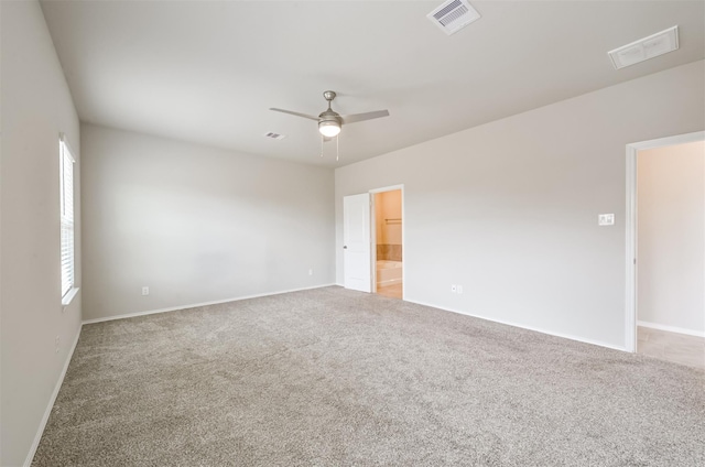 spare room featuring ceiling fan and carpet flooring