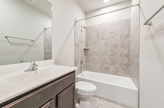 full bathroom featuring toilet, tiled shower / bath combo, tile patterned floors, and vanity