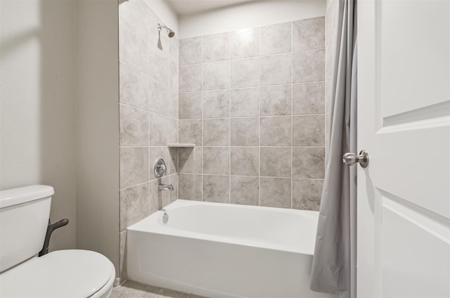 bathroom with toilet and shower / bath combination with curtain