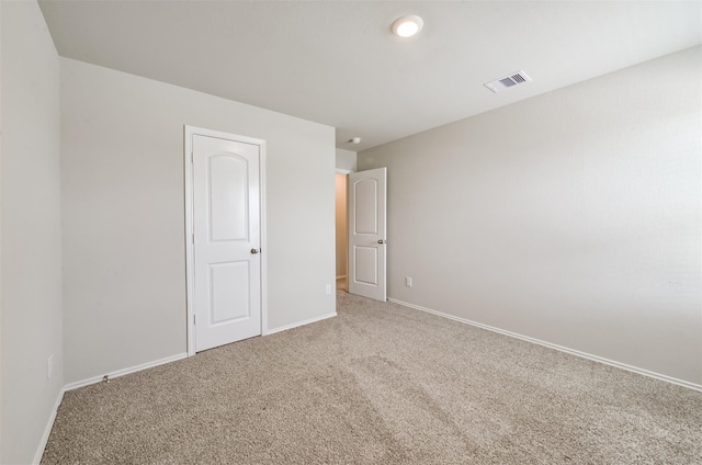 unfurnished bedroom with carpet and a closet