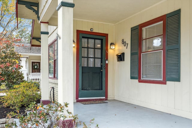 property entrance with covered porch