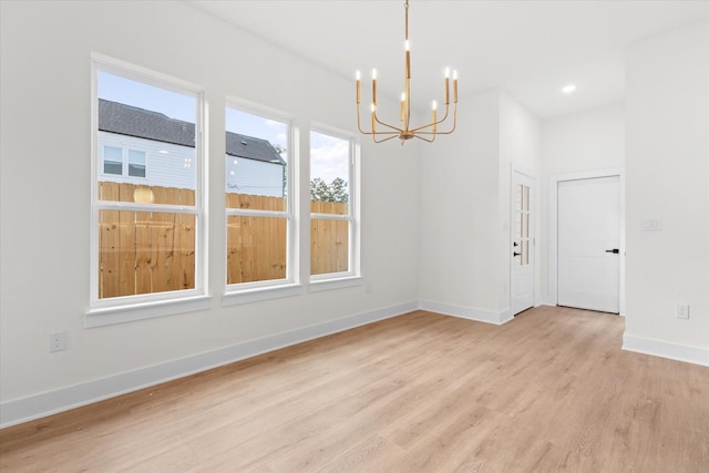 interior space featuring a notable chandelier and light hardwood / wood-style floors