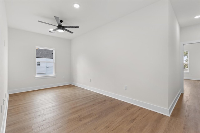 spare room featuring ceiling fan and light hardwood / wood-style flooring