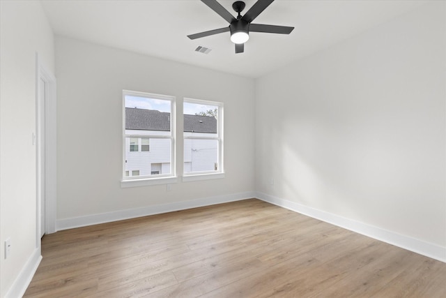 empty room featuring ceiling fan and light hardwood / wood-style flooring