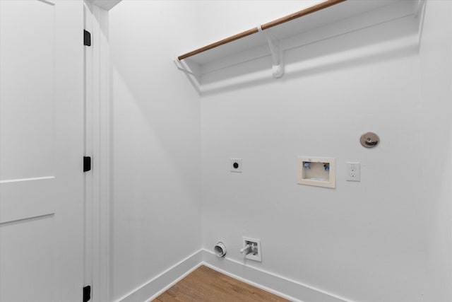 laundry room featuring washer hookup, hardwood / wood-style floors, gas dryer hookup, and electric dryer hookup