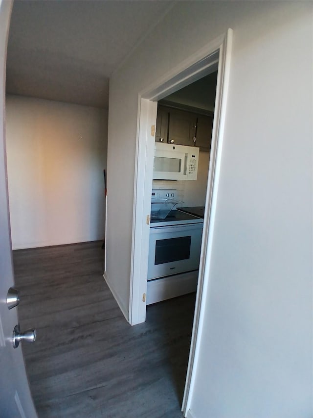 corridor with dark hardwood / wood-style floors