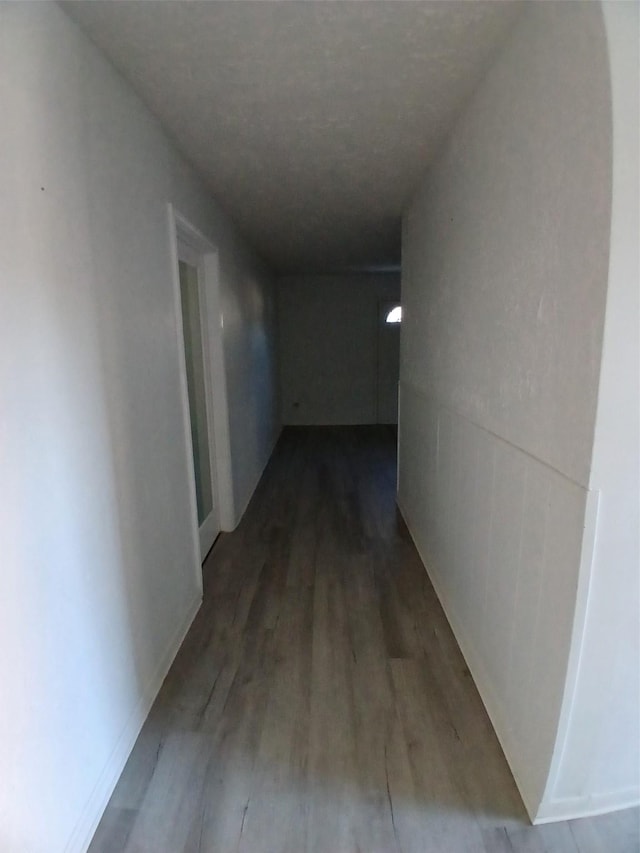 hallway featuring wood-type flooring