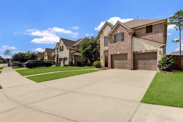 view of front of home featuring a garage and a front yard