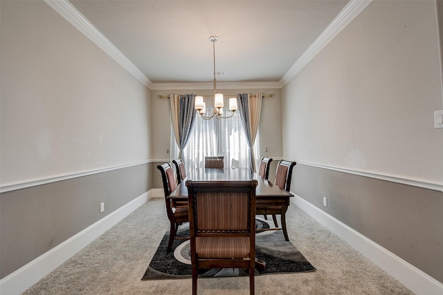 dining space with carpet, a notable chandelier, and ornamental molding