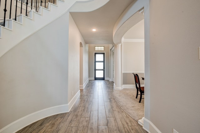 foyer entrance featuring crown molding