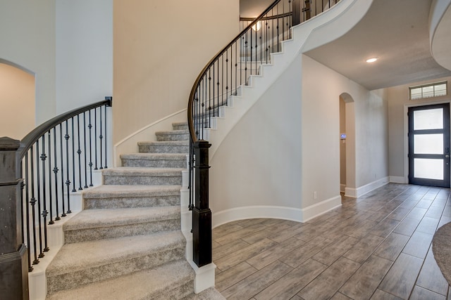 foyer entrance with a high ceiling