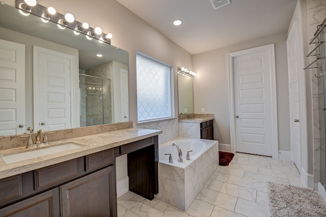 bathroom with plus walk in shower and vanity