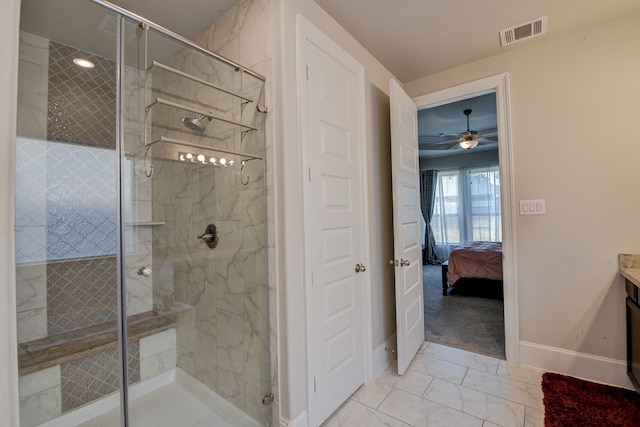 bathroom featuring a shower with shower door, vanity, and ceiling fan