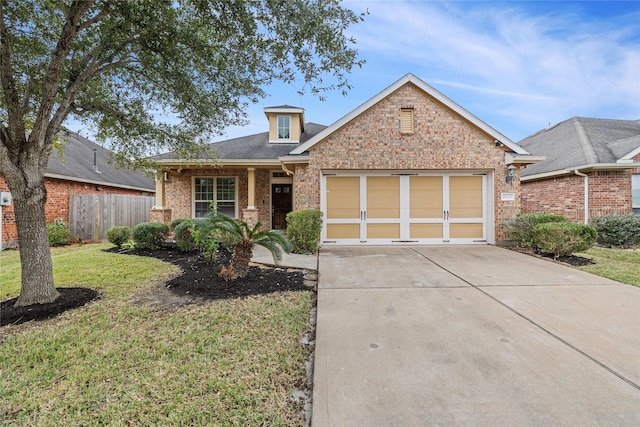 view of front facade featuring a garage and a front lawn