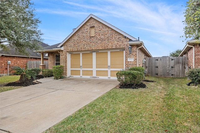 view of front of home with a front yard and a garage