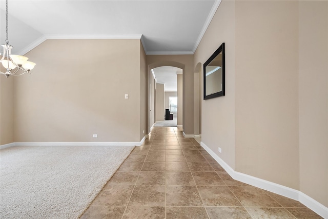 corridor featuring crown molding and a notable chandelier