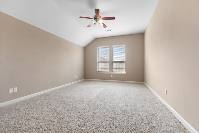 unfurnished room featuring ceiling fan, light carpet, and lofted ceiling