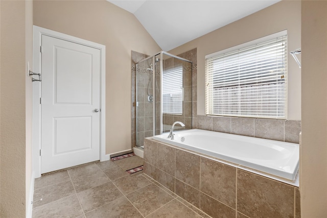 bathroom featuring vaulted ceiling, shower with separate bathtub, and a healthy amount of sunlight