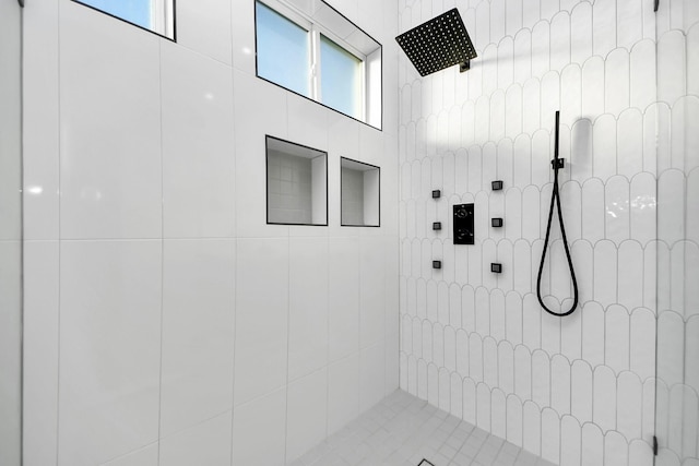 bathroom with a tile shower