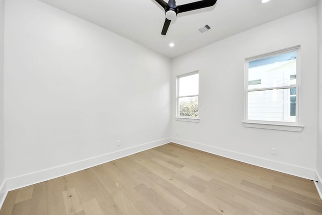 unfurnished room featuring ceiling fan and light hardwood / wood-style flooring