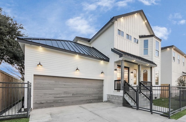 modern inspired farmhouse featuring a porch and a garage