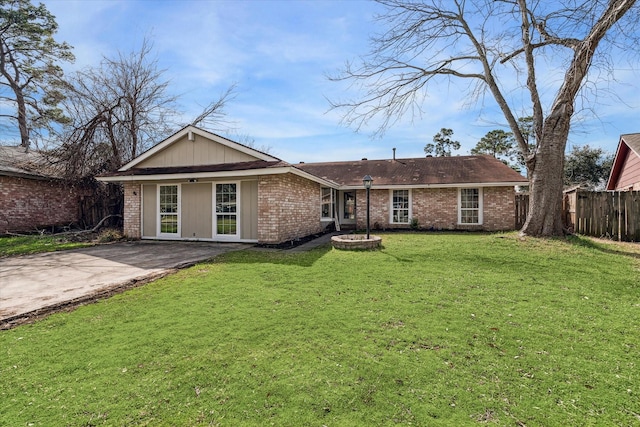 rear view of house with a yard