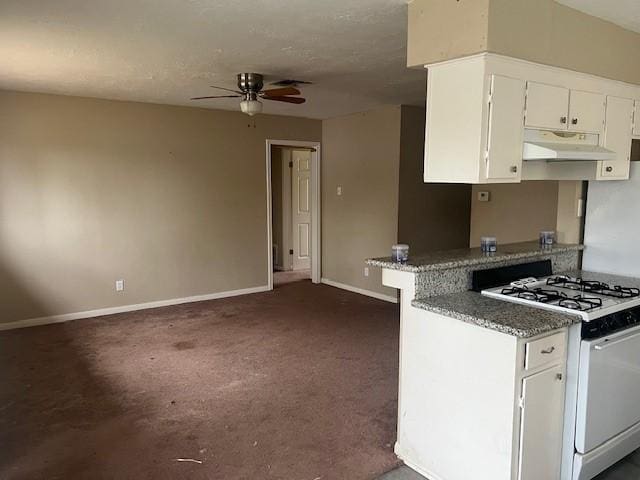 kitchen with white cabinets, kitchen peninsula, white range with gas stovetop, and ceiling fan